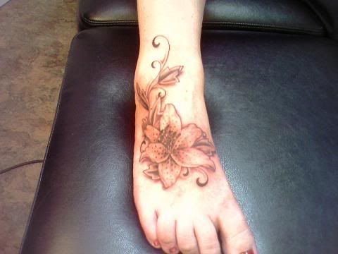 Nice Flower Tattoo on girl Foot