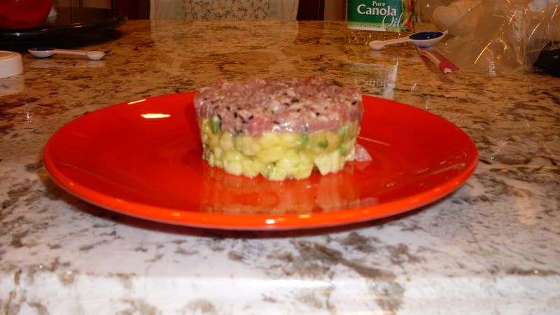 Tuna Tartar with Spicy Asian Viniagrette atop a Pineapple-Avocado Base