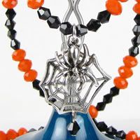 Spooky, Bright Orange and Black with Spider in Web Necklace.