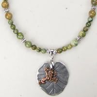 Cute, Copper Frog on a Pewter Lily Pad with Rhyolite Necklace.